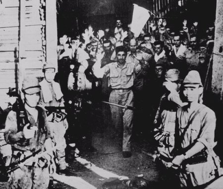 U.S. troops surrender to the Japanese at Corregidor